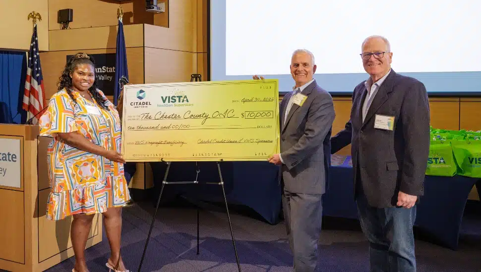 Check presentation at awards ceremony.