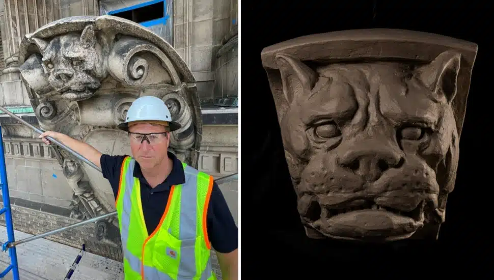Mason poses for picture with historic stone restoration project.