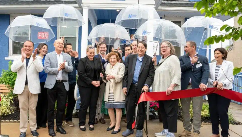 Community members and project partners gather for a ribbon-cutting ceremony celebrating the opening of Ann’s Heart Purcell House transitional housing property in Phoenixville, Pennsylvania.