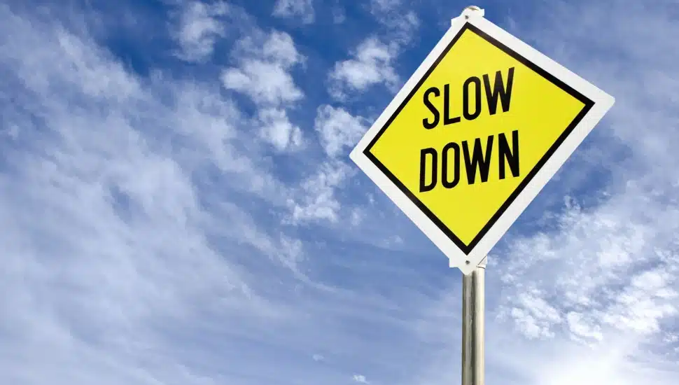 Slow Down road sign.