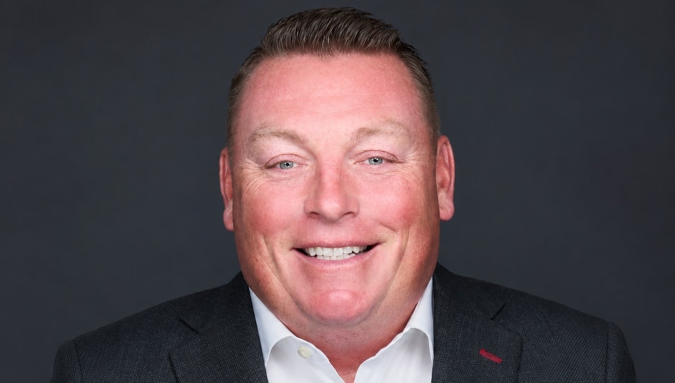 Headshot of middle-aged male wealth management executive.