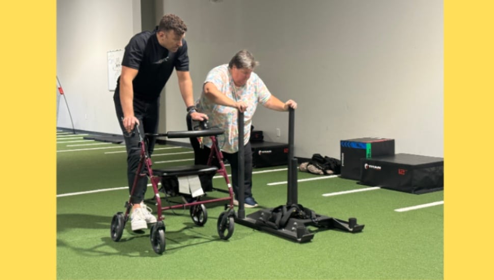 A client receives some fitness training from a Kinetic Physical Therapy staff member.