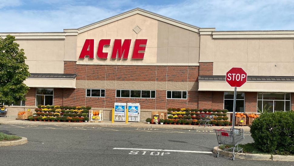 Front of ACME store and road.